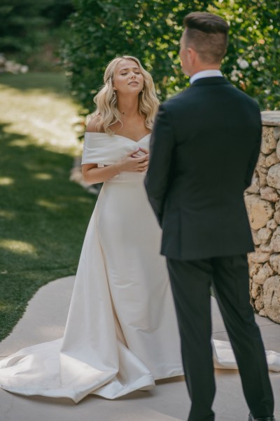 bride and groom greet at alter