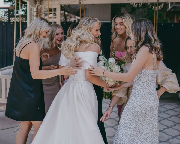 friends guests hug the bride