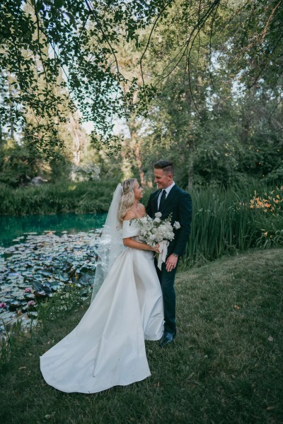 bride and groom embrace hug in garden forest setting