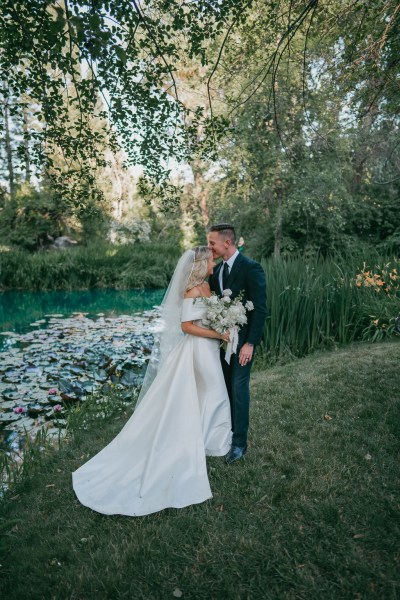 bride and groom embrace hug in garden forest setting