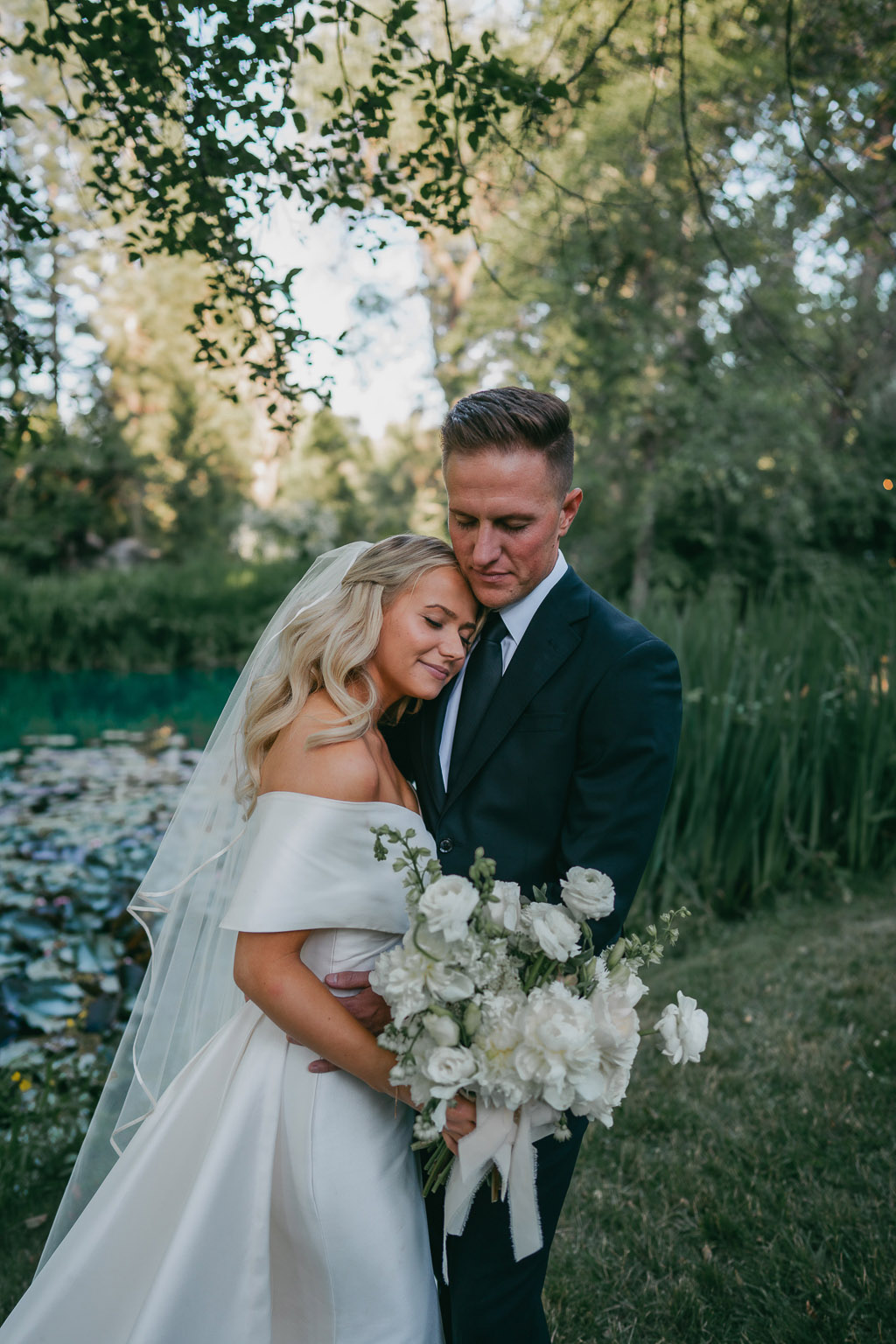 bride and groom embrace hug in garden forest setting