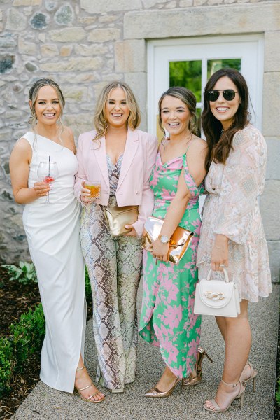 Friends and guests pose for a photo bridesmaid