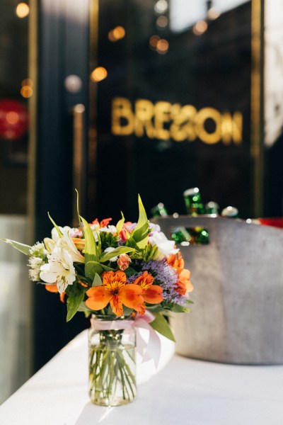 flowers in vase resting on table