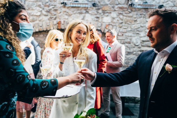 atmosphere shot guests in courtyard they are served drinks champagne