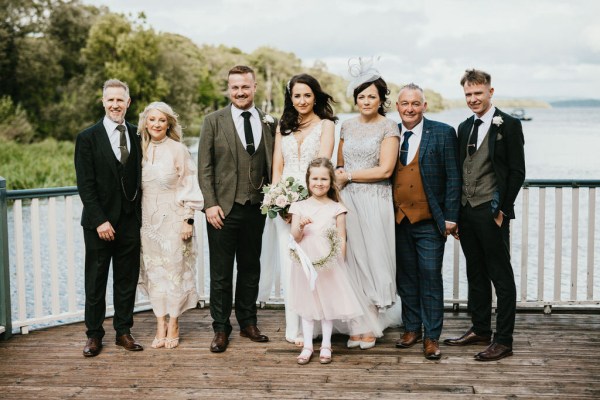 bride groom little girl family mother father portrait overlooking lake setting