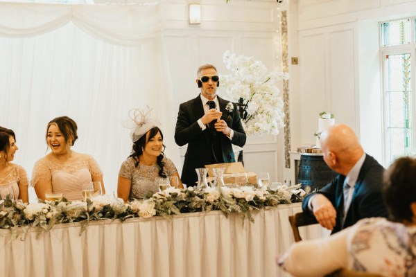 father gives speech at table