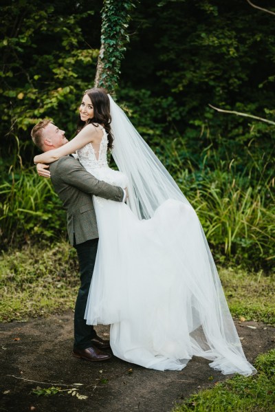 groom picks up bride