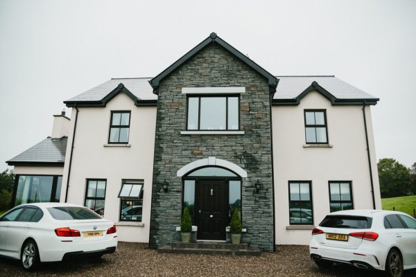 exterior house pathway and two white cars parked in drive