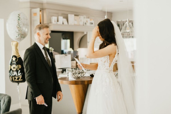 father and bride in kitchen