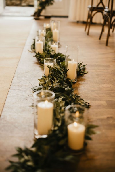 candles lit in a row on floor