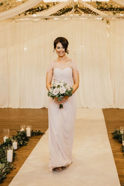 bridesmaid holding flowers bouquet