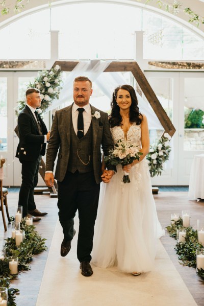 bride and groom exit wedding ceremony