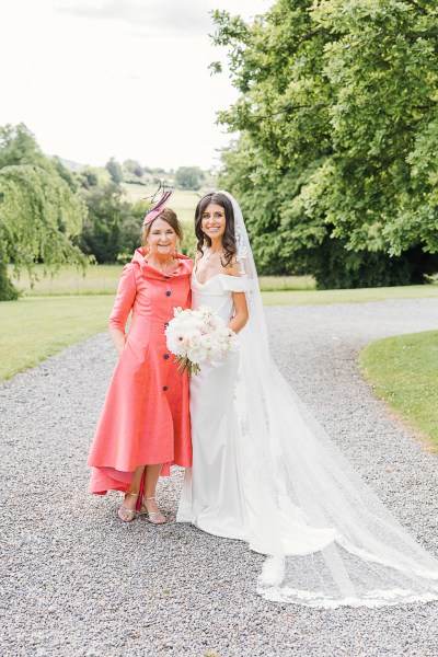 bride and her mother pose for a photo