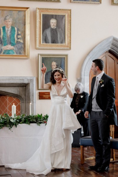 bride and groom all smiles after being wed at alter setting