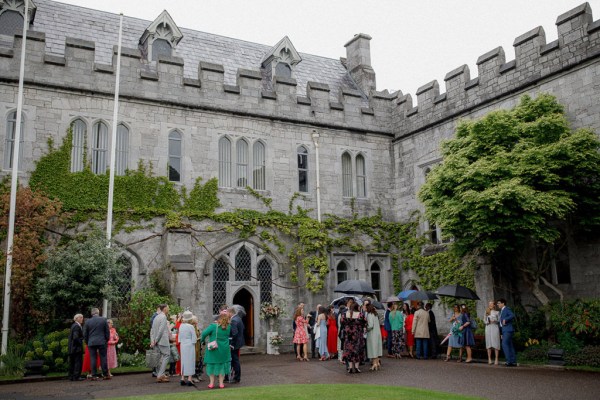 atmosphere shot of guests outside venue on grass