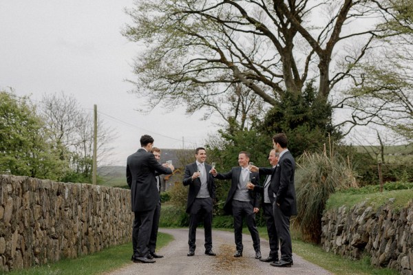 groom and groomsmen in garden forest setting