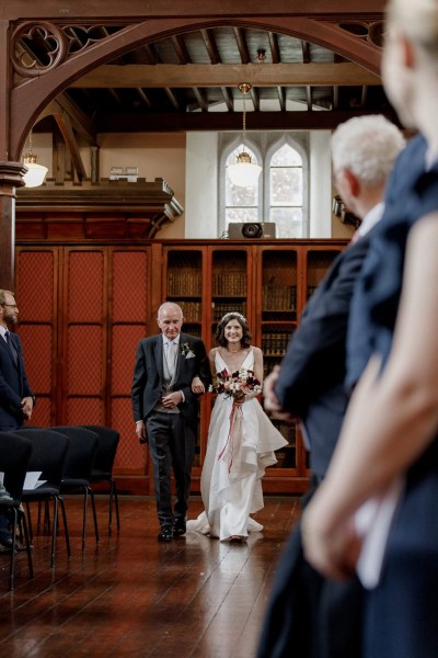 father of the bride walks his daughter down the aisle