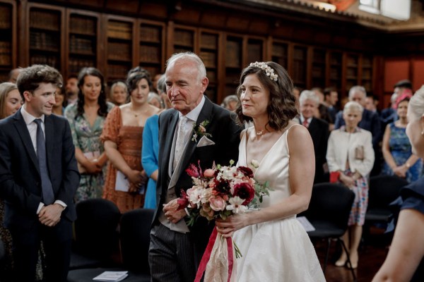 father of the bride walks his daughter down the aisle