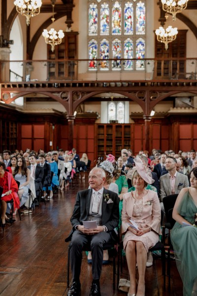 shot of guests seated during wedding ceremony church setting