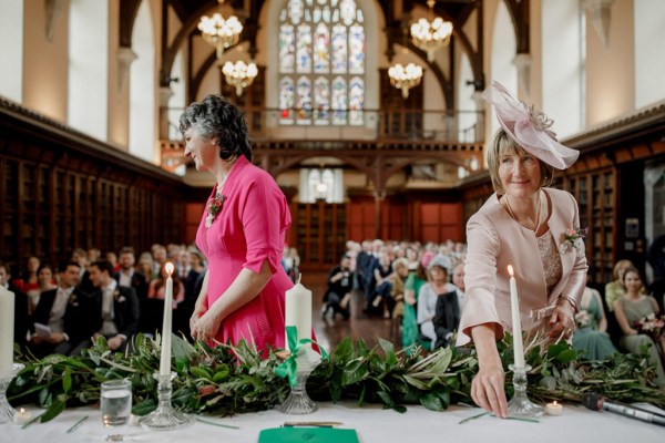 mother in pink gown dress witness to couple getting married