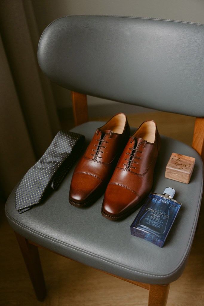 brown brogues grey tie and cologne for groom