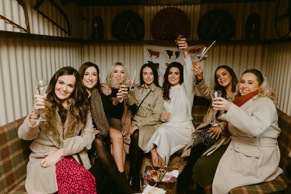 bride with her bridesmaids cheers celebrate