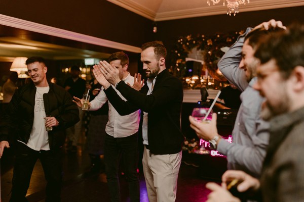 guests clapping interior drinks celebrating