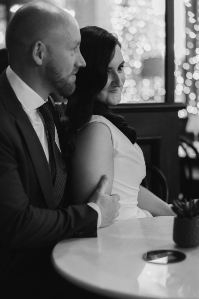 B&W bride and groom in pub setting