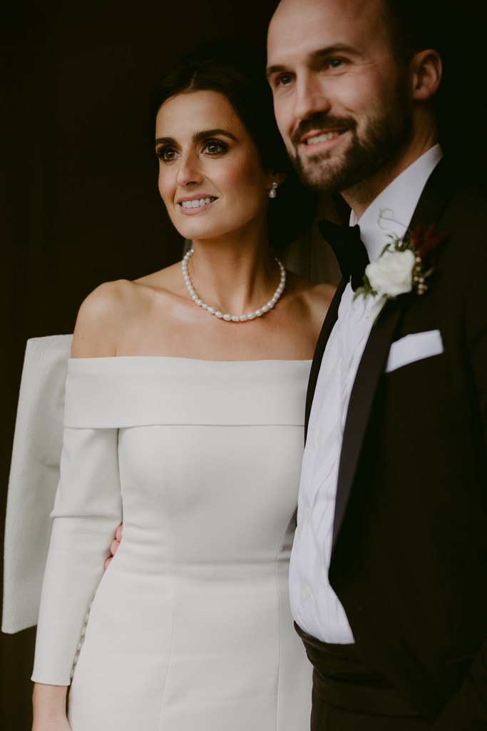 bride and groom smile together