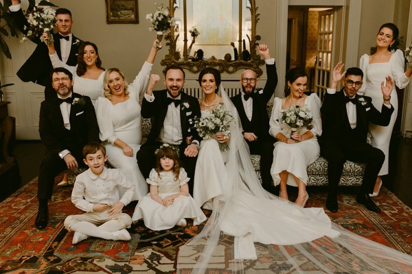 portrait of family children bride groom bridesmaids and groomsmen in Victorian room setting