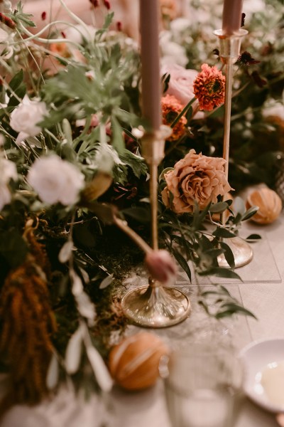 White rose red berries grapes glasses and orange flowers