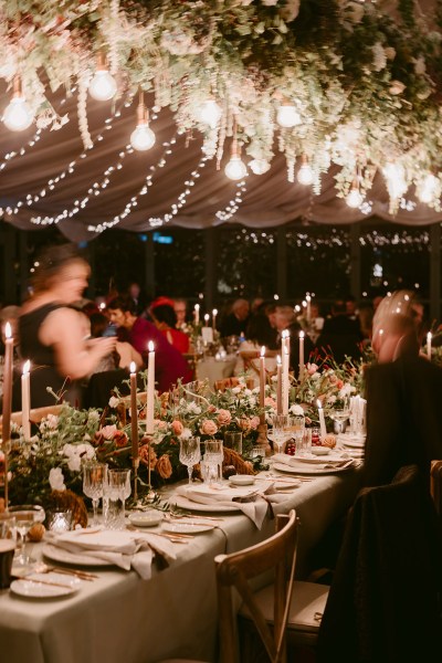 tent lights setting guests seated candles on table