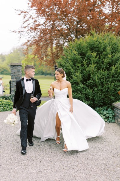 bride and groom walk in the courtyard