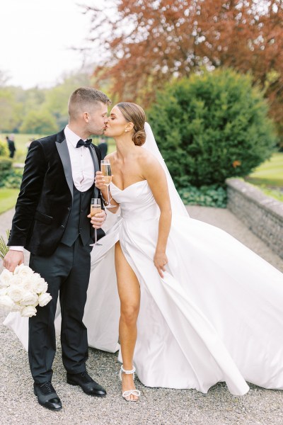 bride and groom kiss in the courtyard