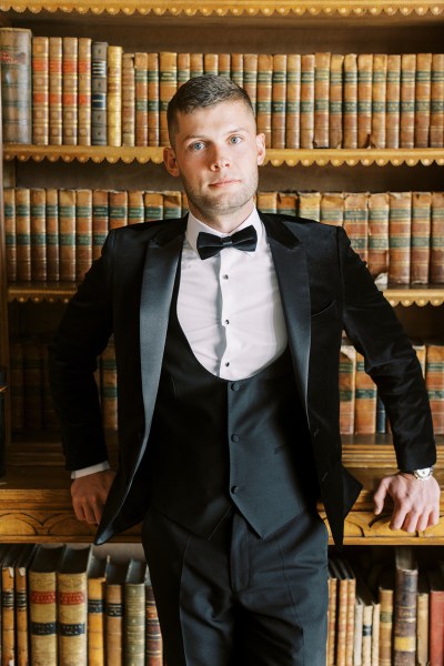 Groom wearing bowtie shirt suit black