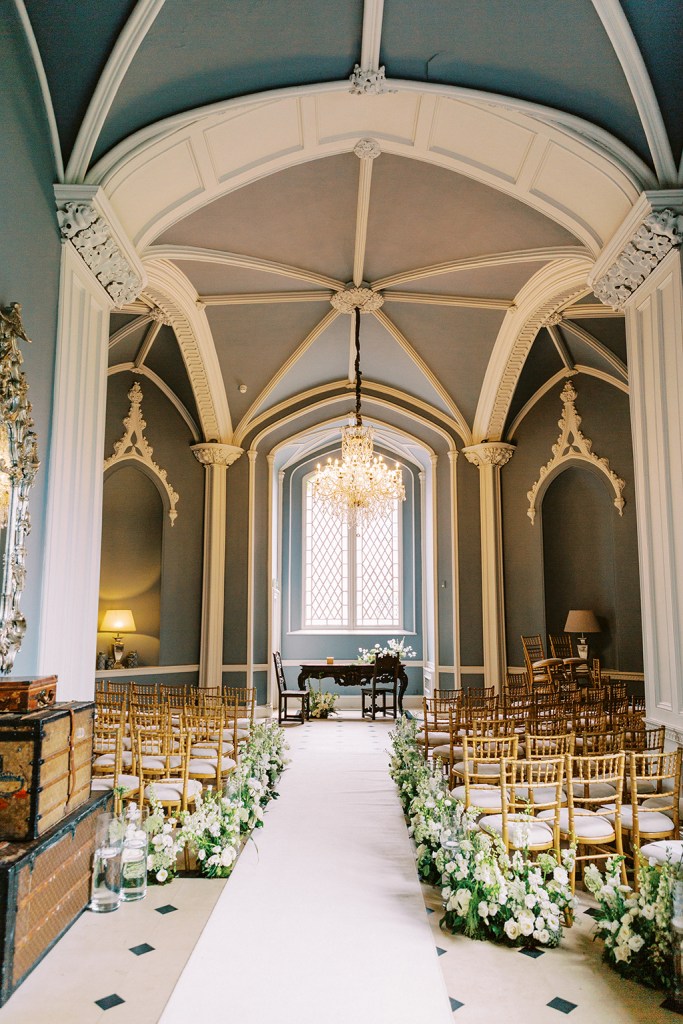 wedding church interior aisle seats flowers