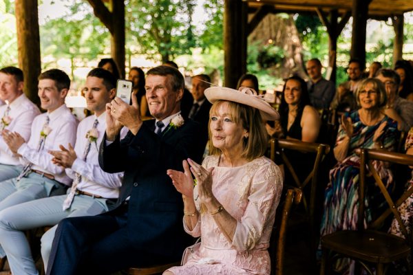 woman and men clapping in audience