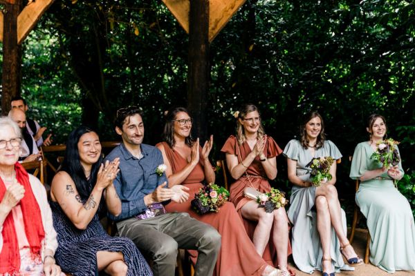 guests clapping in ceremony room