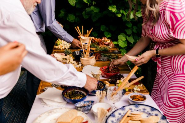 finger food for guests grapes bread sticks dips chives