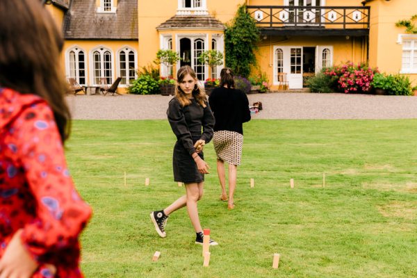 woman playing games outside on the grass