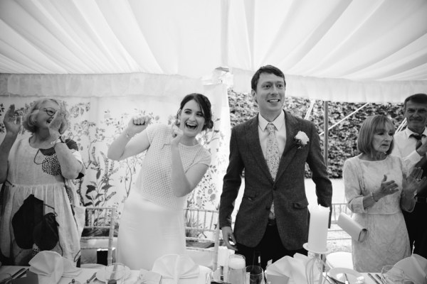 black and white shot of bride and groom interior dining room ballroom