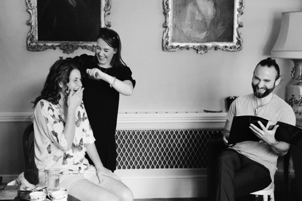 black and white image of bride getting ready getting her hair done by hairstylist