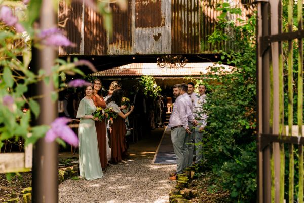 bridesmaids and groomsmen waiting for the bride to enter