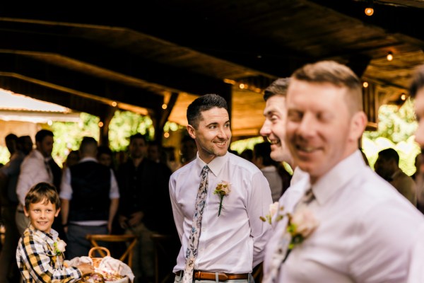 groomsmen await the bride