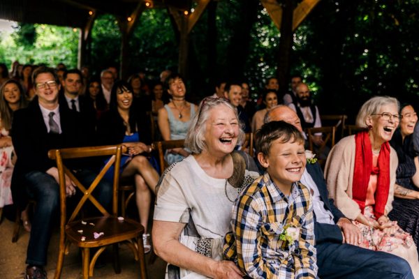 little boy and woman smiling in audience