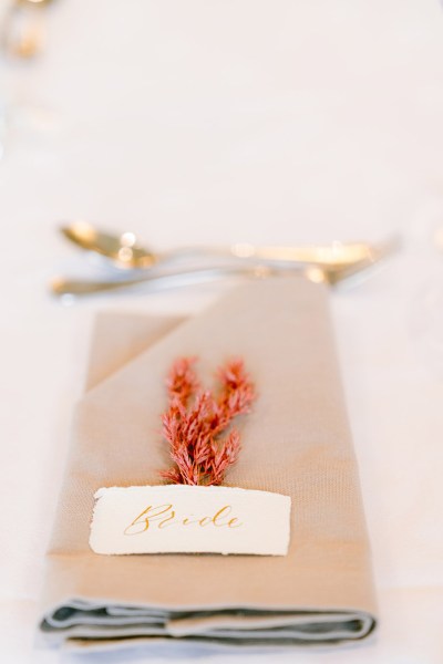 up close gold cutlery and menu detail