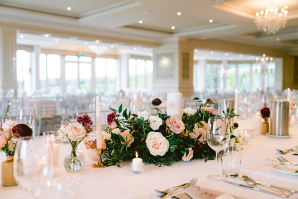 flowers roses on table in dining room laid out for guests