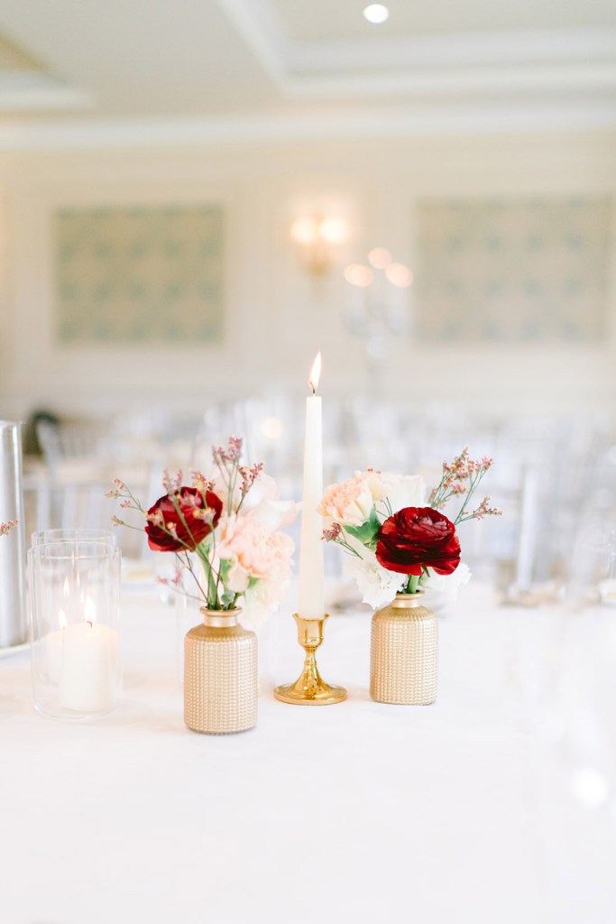 table setting candle lit red roses flowers