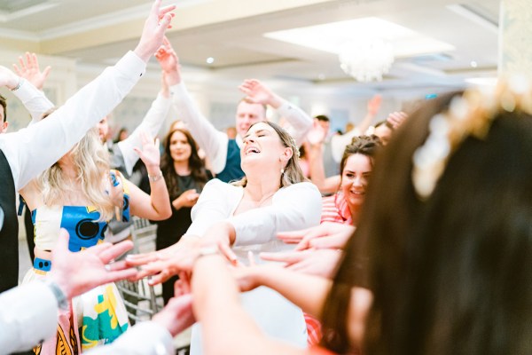 laughing bride amongst guests