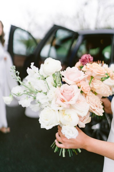 bride holding flowers bouquet roses